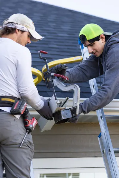 ultimate gutter solutions workers 400x600 1